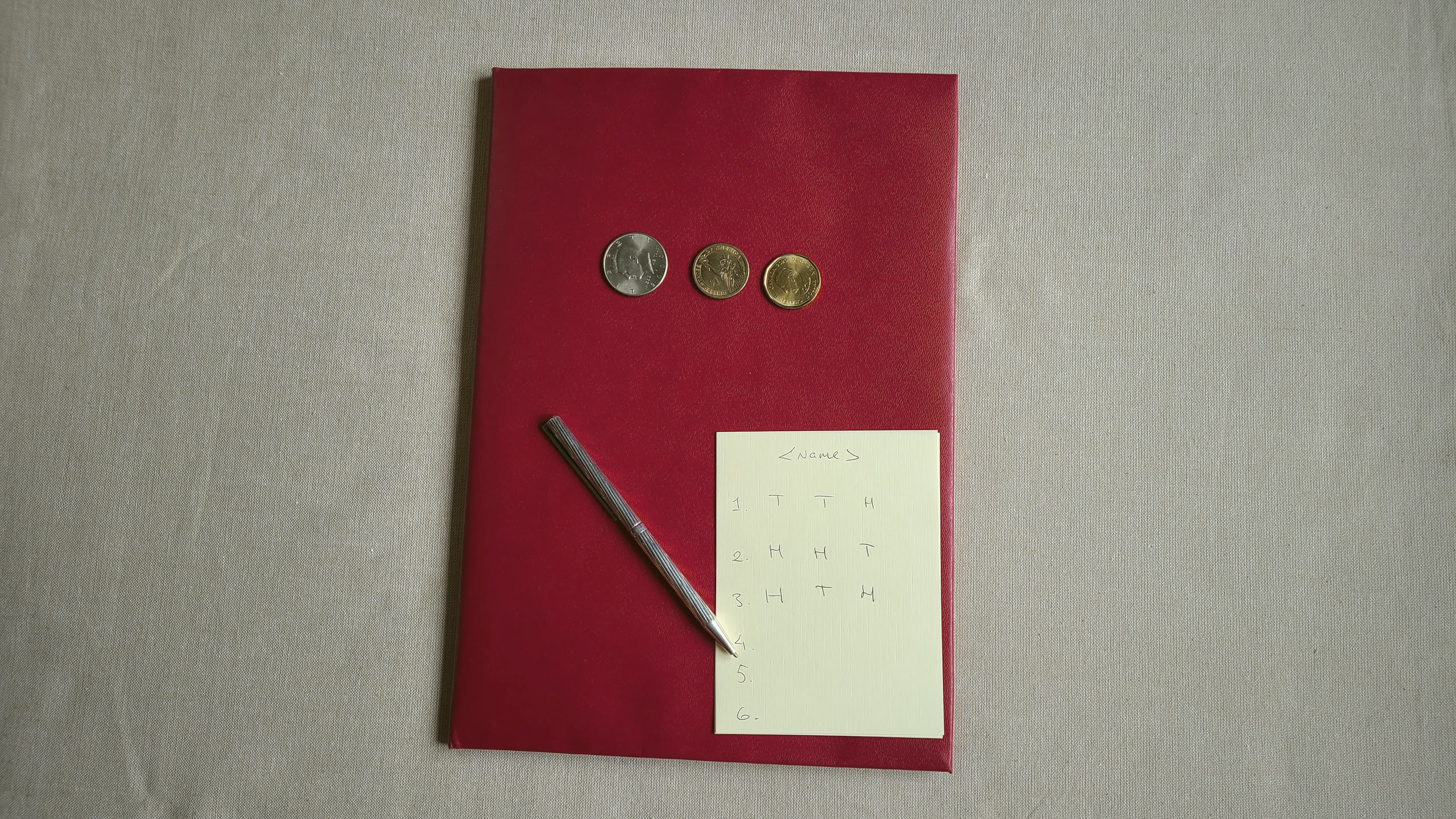 Three coins and the six cast lines recorded on paper